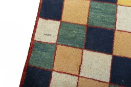 Backside of handmade 2000s Persian Gabbeh rug showing knot structure and weave density