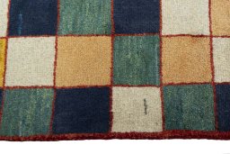 Close-up detail of 2000s Persian Gabbeh rug from Iran / Persia showing Wool weave