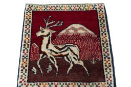 Surface texture of 2000s Persian Gabbeh rug with natural Wool and intricate pattern
