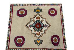 Surface texture of 2000s Persian Gabbeh rug with natural Wool and intricate pattern