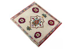 Corner detail of 2000s Persian Gabbeh rug showing border pattern and Wool pile