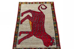 Surface texture of 2000s Persian Gabbeh rug with natural Wool and intricate pattern