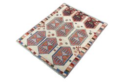 Corner detail of 2000s Persian Gabbeh rug showing border pattern and Wool pile