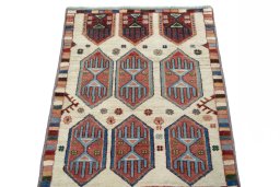 Surface texture of 2000s Persian Gabbeh rug with natural Wool and intricate pattern