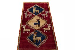 Surface texture of 2000s Persian Gabbeh rug with natural Wool and intricate pattern