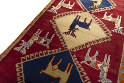 Backside of handmade 2000s Persian Gabbeh rug showing knot structure and weave density