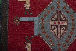 Backside of handmade 2000s Persian Gabbeh rug showing knot structure and weave density