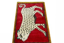 Surface texture of 2000s Persian Gabbeh rug with natural Wool and intricate pattern