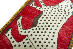 Backside of handmade 2000s Persian Gabbeh rug showing knot structure and weave density