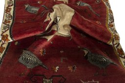 Corner detail of 2000s Persian Gabbeh rug showing border pattern and Wool pile