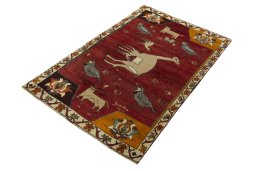 Corner detail of 2000s Persian Gabbeh rug showing border pattern and Wool pile
