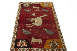 Surface texture of 2000s Persian Gabbeh rug with natural Wool and intricate pattern