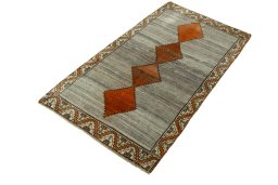 Corner detail of 2000s Persian Gabbeh rug showing border pattern and Wool pile