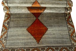 Full view of 2000s Persian Gabbeh rug from Iran / Persia, 196 × 107 cm in Beige tones