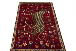 Surface texture of 2000s Persian Gabbeh rug with natural Wool and intricate pattern