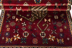 Full view of 2000s Persian Gabbeh rug from Iran / Persia, 192 × 122 cm in Red tones