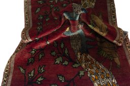 Corner detail of 2000s Persian Gabbeh rug showing border pattern and Wool pile