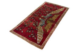 Corner detail of 2000s Persian Gabbeh rug showing border pattern and Wool pile