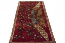 Surface texture of 2000s Persian Gabbeh rug with natural Wool and intricate pattern