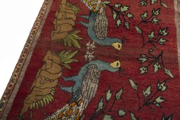 Backside of handmade 2000s Persian Gabbeh rug showing knot structure and weave density