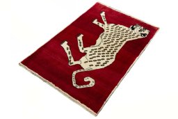 Corner detail of 2000s Persian Gabbeh rug showing border pattern and Wool pile