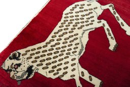Backside of handmade 2000s Persian Gabbeh rug showing knot structure and weave density