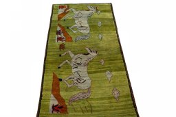 Surface texture of 2000s Persian Gabbeh rug with natural Wool and intricate pattern