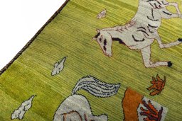 Backside of handmade 2000s Persian Gabbeh rug showing knot structure and weave density