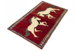 Corner detail of 2000s Persian Gabbeh rug showing border pattern and Wool pile