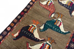 Backside of handmade 2000s Persian Gabbeh rug showing knot structure and weave density