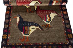 Full view of 2000s Persian Gabbeh rug from Iran / Persia, 143 × 85 cm in Beige tones