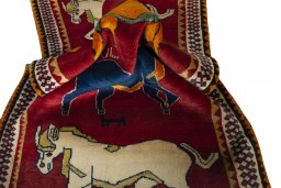 Corner detail of 2000s Persian Gabbeh rug showing border pattern and Wool pile