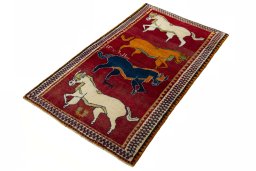 Corner detail of 2000s Persian Gabbeh rug showing border pattern and Wool pile
