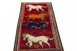 Surface texture of 2000s Persian Gabbeh rug with natural Wool and intricate pattern