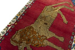 Backside of handmade 2000s Persian Gabbeh rug showing knot structure and weave density
