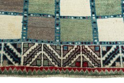Central medallion detail of 2000s Persian Gabbeh rug from Iran / Persia