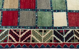 Close-up detail of 2000s Persian Gabbeh rug from Iran / Persia showing Wool weave