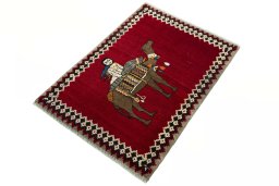 Corner detail of 2000s Persian Gabbeh rug showing border pattern and Wool pile