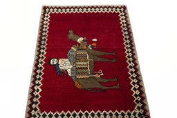 Surface texture of 2000s Persian Gabbeh rug with natural Wool and intricate pattern