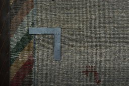Corner detail of New Persian Gabbeh rug showing border pattern and Wool pile