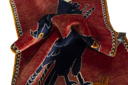 Corner detail of 2000s Persian Gabbeh rug showing border pattern and Wool pile