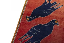 Backside of handmade 2000s Persian Gabbeh rug showing knot structure and weave density