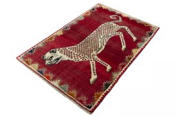 Corner detail of 2000s Persian Gabbeh rug showing border pattern and Wool pile