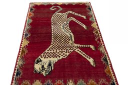 Surface texture of 2000s Persian Gabbeh rug with natural Wool and intricate pattern