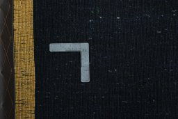 Corner detail of New Persian Gabbeh rug showing border pattern and Wool pile