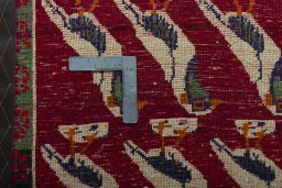 Backside of handmade 2000s Persian Gabbeh rug showing knot structure and weave density