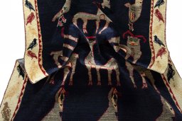 Corner detail of 2000s Persian Gabbeh rug showing border pattern and Wool pile