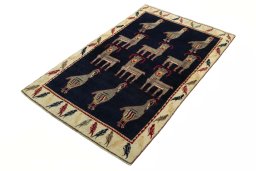 Corner detail of 2000s Persian Gabbeh rug showing border pattern and Wool pile