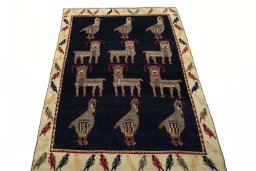Surface texture of 2000s Persian Gabbeh rug with natural Wool and intricate pattern