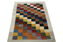 Surface texture of 2000s Persian Gabbeh rug with natural Wool and intricate pattern
